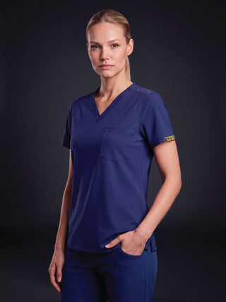 Kyur women's navy V-neck scrub top and pants, front view