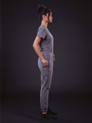 Kyur women's slate gray scrub top and jogger-style pants, side profile view