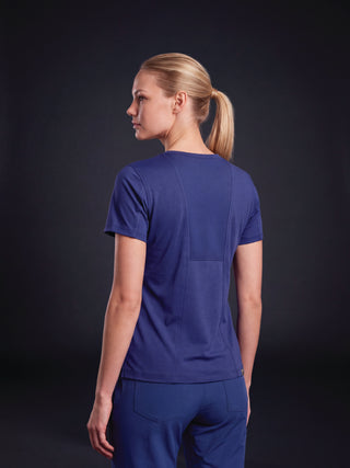 Kyur women's navy scrub top and pants, back view