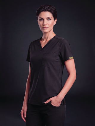 Kyur women's dark purple V-neck scrub top and pants, full front view
