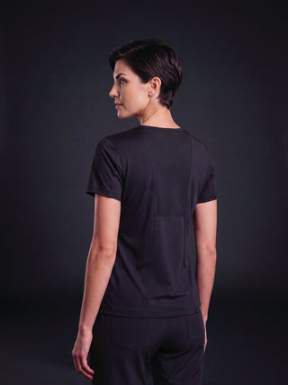 Kyur women's dark purple scrub top and pants, back view